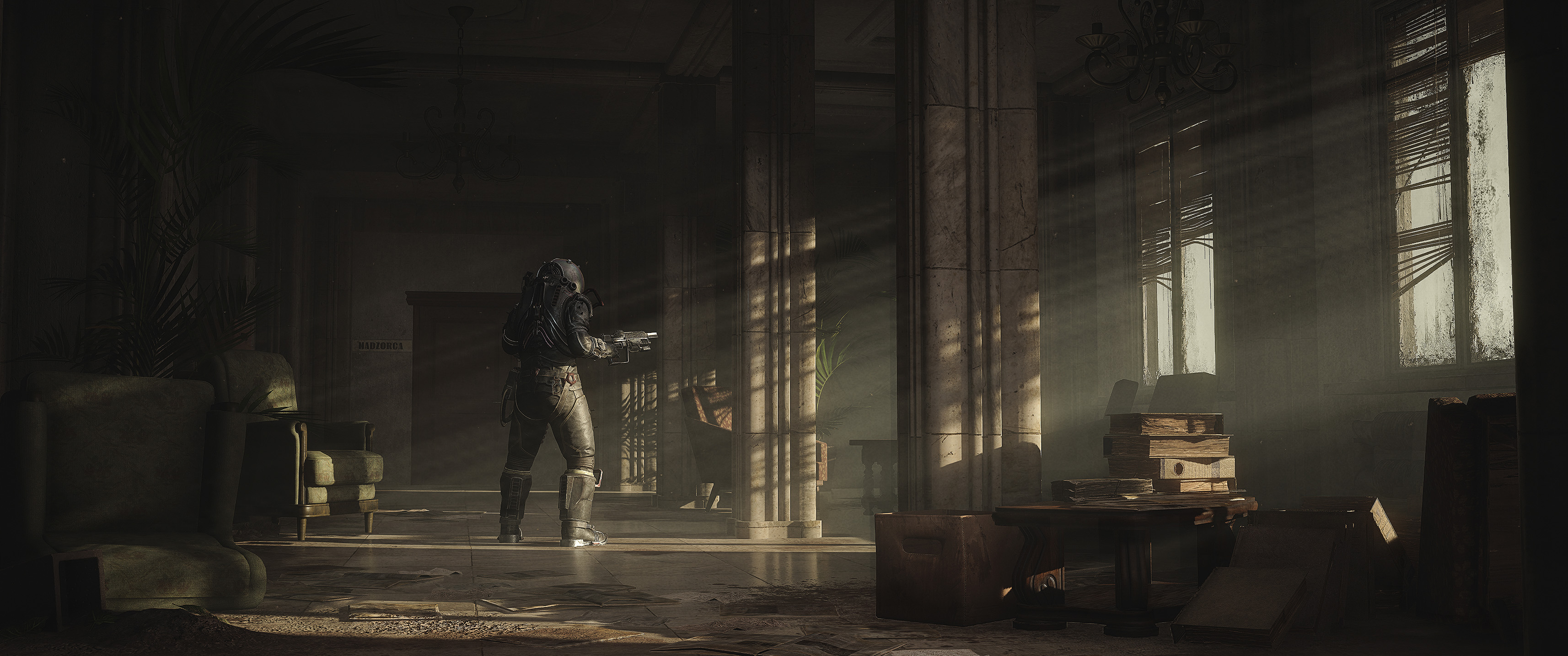 A columned hall with light falling through the windows, shot level with the floor because the camera cannot be raised.